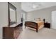 Vaulted ceiling bedroom with dark wood furnishings and neutral color scheme at 10550 W Alexander Rd # 2064, Las Vegas, NV 89129