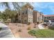Well maintained two-story home with desert landscaping, and a walkway at 10550 W Alexander Rd # 2064, Las Vegas, NV 89129