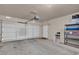 Well-lit garage with a functional layout, featuring a garage door, storage racks, and ample space at 10550 W Alexander Rd # 2064, Las Vegas, NV 89129