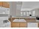 Bright kitchen view showcases white appliances, tile floor, and laminate countertops at 10550 W Alexander Rd # 2064, Las Vegas, NV 89129
