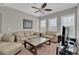 Relaxing living room features neutral walls, plush seating, and a stylish coffee table at 10550 W Alexander Rd # 2064, Las Vegas, NV 89129