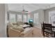 Bright living room boasts neutral walls, comfortable furniture, and plenty of natural light at 10550 W Alexander Rd # 2064, Las Vegas, NV 89129