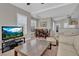 Inviting living area with a dining table, modern entertainment center and kitchen view at 10550 W Alexander Rd # 2064, Las Vegas, NV 89129