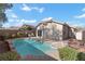 Inviting backyard pool with well-kept landscaping and a patio, perfect for relaxing on a sunny day at 11076 Zampino St, Las Vegas, NV 89141