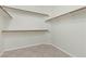 Walk-in closet featuring wood trim shelving and tile flooring at 11076 Zampino St, Las Vegas, NV 89141