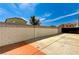 A private backyard with concrete block wall to provide privacy, a gate and a patio area at 1110 Azure Heights Pl, Las Vegas, NV 89110