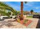 Well-manicured backyard with a charming gazebo, hot tub, artificial turf, and inviting seating area at 1110 Azure Heights Pl, Las Vegas, NV 89110