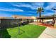 Backyard featuring green lawn, a BBQ area, hot tub, palm tree, and patio at 1110 Azure Heights Pl, Las Vegas, NV 89110