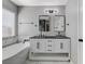 Dual sink bathroom with modern vanities, a bathtub, and elegant fixtures at 1110 Azure Heights Pl, Las Vegas, NV 89110