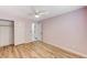 Bedroom features hardwood floors, closet, bathroom entrance, and ceiling fan at 1110 Azure Heights Pl, Las Vegas, NV 89110