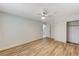 Bedroom featuring hardwood floors, closet, ceiling fan, and bathroom entrance at 1110 Azure Heights Pl, Las Vegas, NV 89110