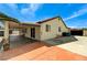 Home exterior showcasing a covered patio, concrete extension, and convenient access to the backyard at 1110 Azure Heights Pl, Las Vegas, NV 89110