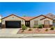 Inviting single-story home features a well-manicured front yard and convenient two-car garage at 1110 Azure Heights Pl, Las Vegas, NV 89110