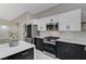 Well-appointed kitchen with stainless steel appliances, an island with drawers, and sleek cabinetry at 1110 Azure Heights Pl, Las Vegas, NV 89110