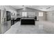 Bright kitchen boasts stainless steel appliances, a central island with seating, and white and dark-toned cabinets at 1110 Azure Heights Pl, Las Vegas, NV 89110