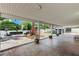 Large covered patio includes a seating area, spa and well manicured backyard at 1110 Azure Heights Pl, Las Vegas, NV 89110