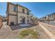 Spacious backyard with potential for customization, featuring a concrete patio and gravel landscaping at 1129 Paradise Vista Dr, Henderson, NV 89002