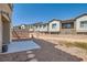 The backyard features a gravel area, with a privacy wall at 1129 Paradise Vista Dr, Henderson, NV 89002