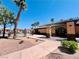 Community clubhouse featuring a shaded entrance, desert landscaping, and refreshing pool in the background at 1129 Paradise Vista Dr, Henderson, NV 89002