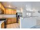 Bright kitchen boasts stainless appliances, breakfast bar, tile floor, and ample cabinets at 1129 Paradise Vista Dr, Henderson, NV 89002