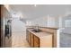 Open kitchen features a breakfast bar with double sink, ample counter space and tile flooring at 1129 Paradise Vista Dr, Henderson, NV 89002