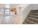 Bright and airy living room features tile flooring, a staircase, and an open layout, great for entertaining at 1129 Paradise Vista Dr, Henderson, NV 89002