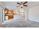 Inviting living room with new carpet, an open floor plan, and a view of the modern kitchen at 1129 Paradise Vista Dr, Henderson, NV 89002