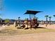 Community playground with slides, climbing structure, and covered picnic area at 1129 Paradise Vista Dr, Henderson, NV 89002