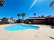 Sparkling community pool with clear blue water, surrounded by palm trees and well-maintained landscaping at 1129 Paradise Vista Dr, Henderson, NV 89002