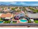 Aerial view of a single-Gathering home featuring a refreshing pool, patio and pergola at 1142 Teal Point Dr, Henderson, NV 89074