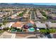 Aerial view of a suburban neighborhood with backyard pools and lush landscaping at 1142 Teal Point Dr, Henderson, NV 89074