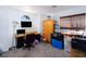 This bedroom features a desk, TV, wardrobe, and natural light from the window to the right at 1142 Teal Point Dr, Henderson, NV 89074