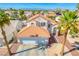 Beautiful home featuring a spacious two car garage, neutral stucco, and a red tile roof at 1142 Teal Point Dr, Henderson, NV 89074