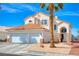 Inviting two-story home featuring a terracotta roof, desert landscaping, and a two-car garage at 1142 Teal Point Dr, Henderson, NV 89074