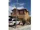 Two-story home with a two-car garage with decorative shutters at 1286 N Sloan Ln, Las Vegas, NV 89110
