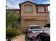 Two-story home with a two-car garage and desert landscaping at 1286 N Sloan Ln, Las Vegas, NV 89110