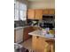Kitchen with stainless steel appliances and tile backsplash at 1286 N Sloan Ln, Las Vegas, NV 89110