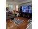 Cozy living room featuring a large television and comfortable seating at 1286 N Sloan Ln, Las Vegas, NV 89110