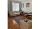 Bright living room with hardwood floors and a comfortable sofa at 1286 N Sloan Ln, Las Vegas, NV 89110