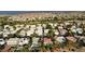 Aerial view showcasing a home with a pool in a beautiful desert community at 129 Chateau Whistler Ct, Las Vegas, NV 89148