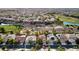 Wide aerial view showing a home nestled near a lush golf course at 129 Chateau Whistler Ct, Las Vegas, NV 89148