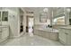 Bright bathroom with double vanity, large soaking tub, and modern finishes at 129 Chateau Whistler Ct, Las Vegas, NV 89148