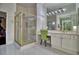 Bathroom featuring a modern shower, bright lighting, and vanity area at 129 Chateau Whistler Ct, Las Vegas, NV 89148