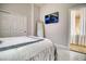 Well-lit bedroom with a large closet and adjacent bathroom access, designed for convenience and privacy at 129 Chateau Whistler Ct, Las Vegas, NV 89148