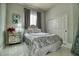 Stylish bedroom featuring a plush bed, mirrored nightstand, and elegant decor providing a serene retreat at 129 Chateau Whistler Ct, Las Vegas, NV 89148