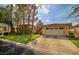 Charming single-story home featuring a well-manicured lawn and a two-car garage at 129 Chateau Whistler Ct, Las Vegas, NV 89148