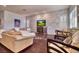Cozy living room with a decorative stone accent wall and elegant furnishings at 129 Chateau Whistler Ct, Las Vegas, NV 89148
