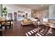 Open living room area with hardwood flooring, lots of natural light, and elegant furniture at 129 Chateau Whistler Ct, Las Vegas, NV 89148