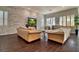 Bright living room featuring hardwood floors, neutral paint, and white shutter blinds at 129 Chateau Whistler Ct, Las Vegas, NV 89148