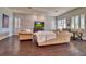 Bright living room with hardwood flooring, stone accent wall and neutral furniture at 129 Chateau Whistler Ct, Las Vegas, NV 89148